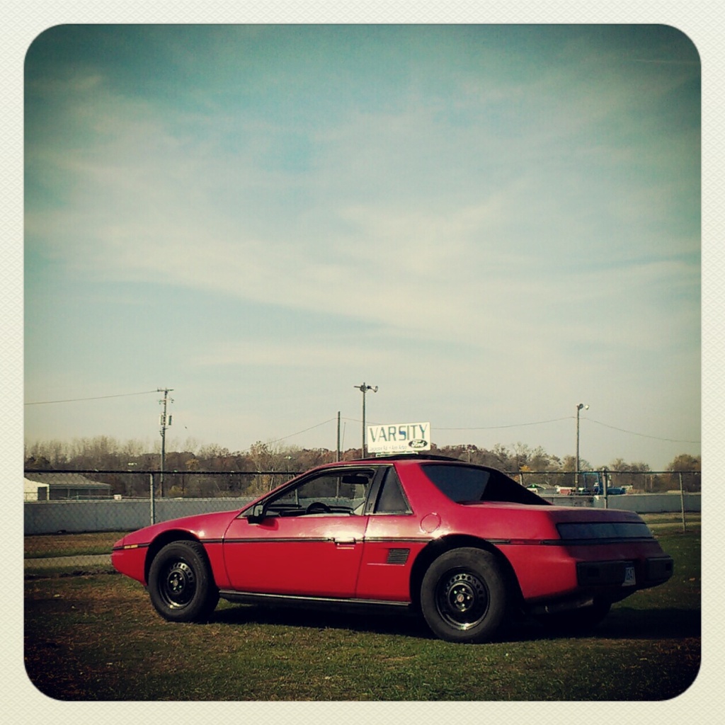 Red 1985 Pontiac Fiero 2m4