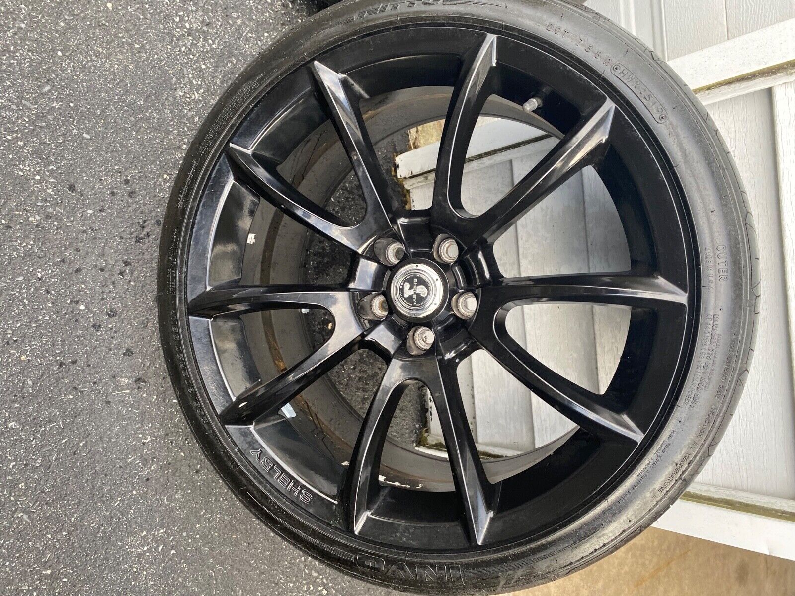 20 inch black Shelby Cobra Mustang original stamped wheels and tires.