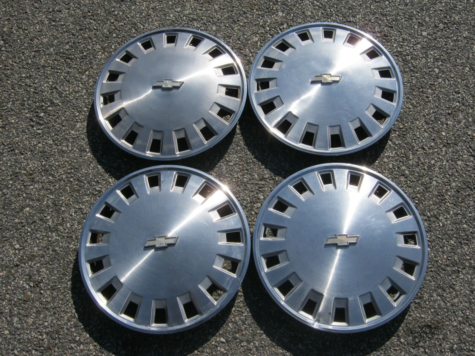 Factory original 1986 to 1990 Chevy Celebrity 14 inch hubcaps wheel covers
