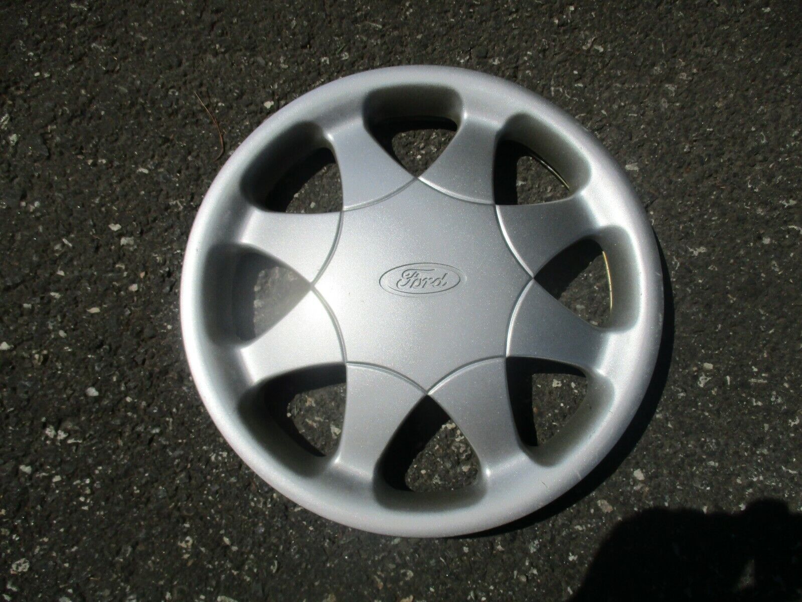 One factory 1997 Ford Aspire13 inch hubcap wheel cover