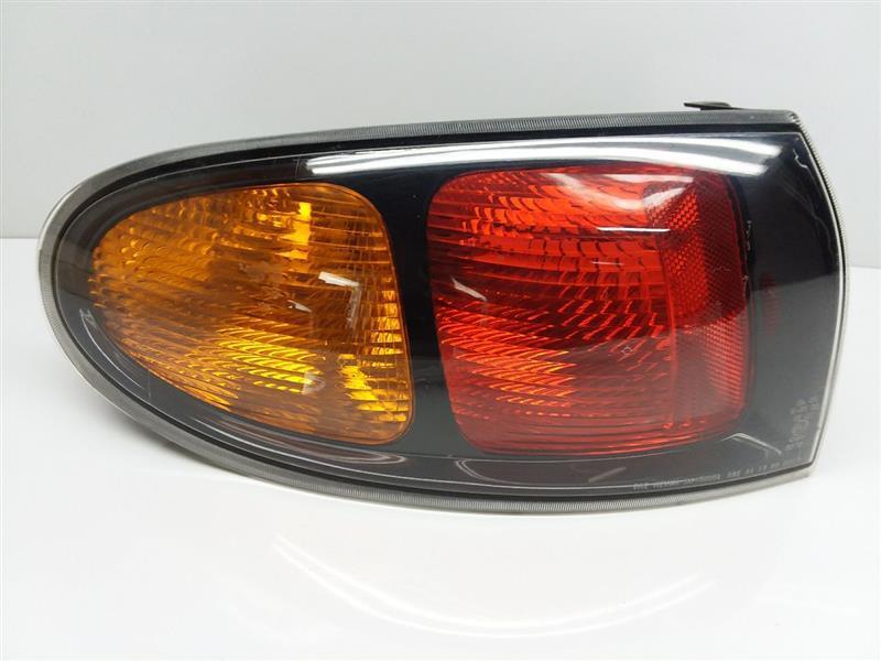 Used Left Tail Light Assembly fits: 2001 Daewoo Lanos Htbk 3 Dr quarter panel mo