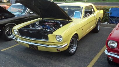 yellow 1965 Ford Mustang hardtop