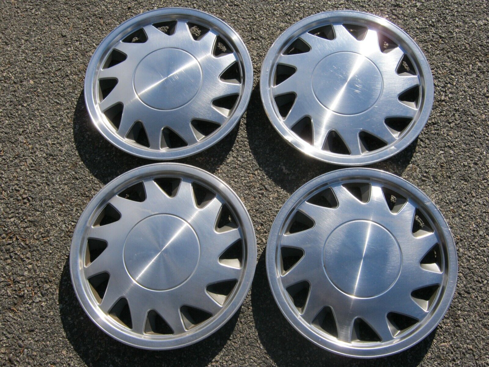 Factory original 1988 to 1990 Plymouth Sundance 14 inch hubcaps wheel covers