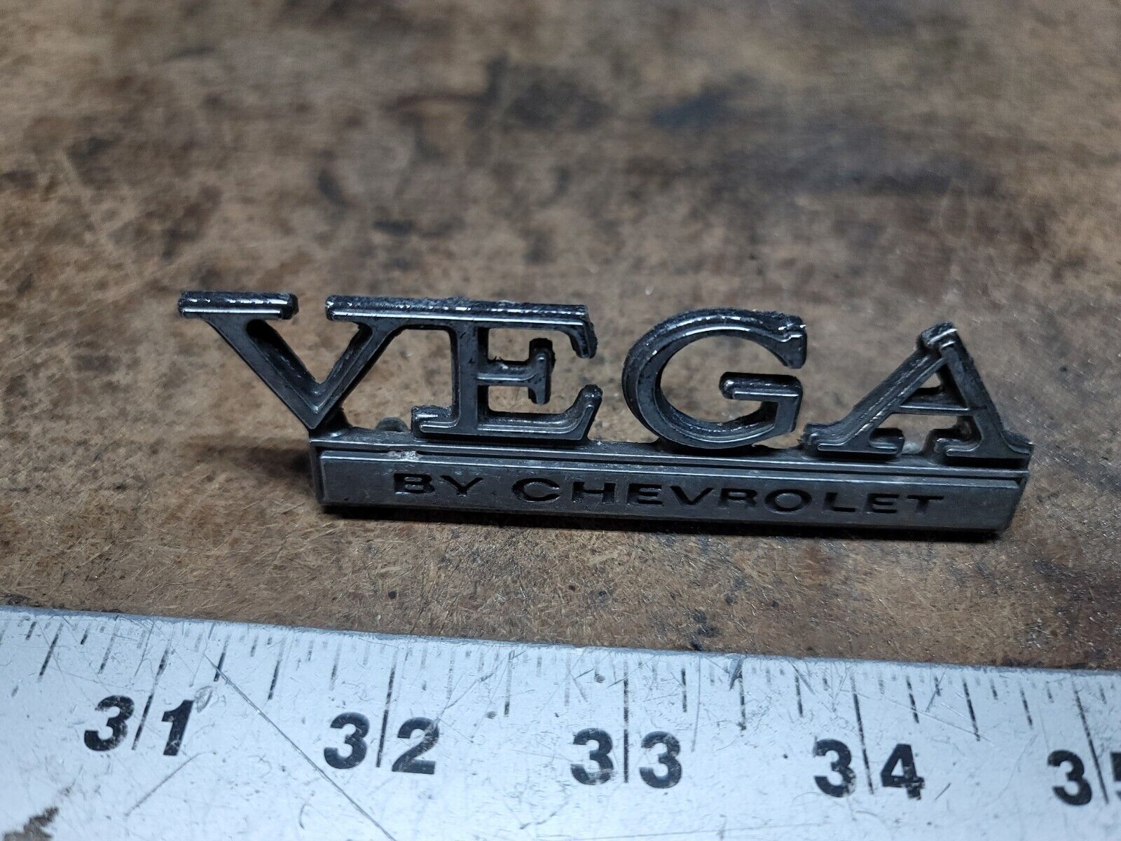 1973-1977 Chevy Vega Header Rear Body Panel Emblem 1700895